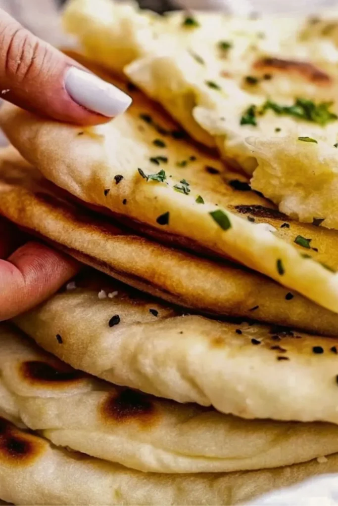 woman holding naan bread
